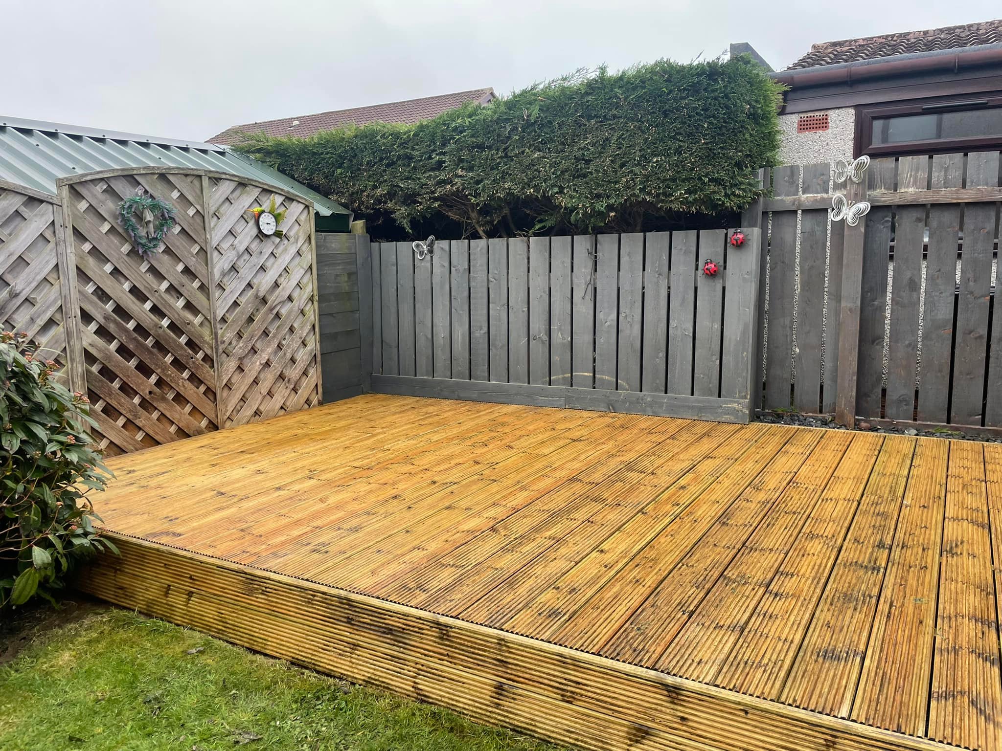 Timber garden decking after a Granite City Jetters clean in Aberdeen