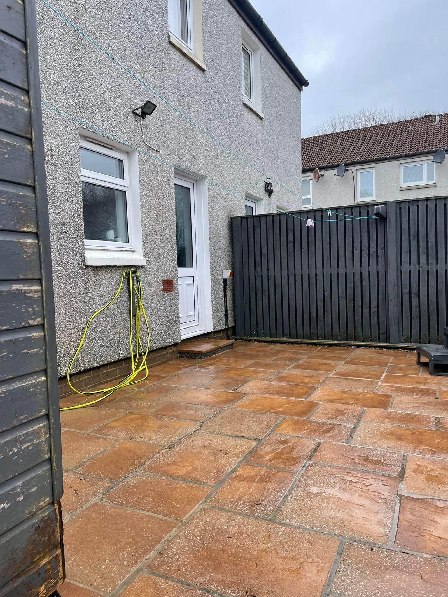 Natural stone patio cleaned and brightened after treatment